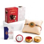 Periapt Rakhi with Chocolate for Brother – Stylish Round Shape Feather Design Rakhi with Chocolate (96g) with Silver Color Pooja Coin, Greeting Card & Tilak Set – Raksha Bandhan Pack (K1_130_EM32)