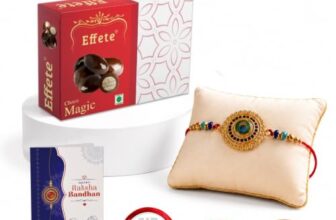 Periapt Rakhi with Chocolate for Brother – Stylish Round Shape Feather Design Rakhi with Chocolate (96g) with Silver Color Pooja Coin, Greeting Card & Tilak Set – Raksha Bandhan Pack (K1_130_EM32)